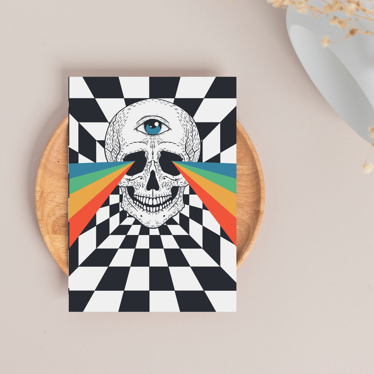 Horizontal rainbow rays radiate from the third-eye position across the skull toward both card edges.