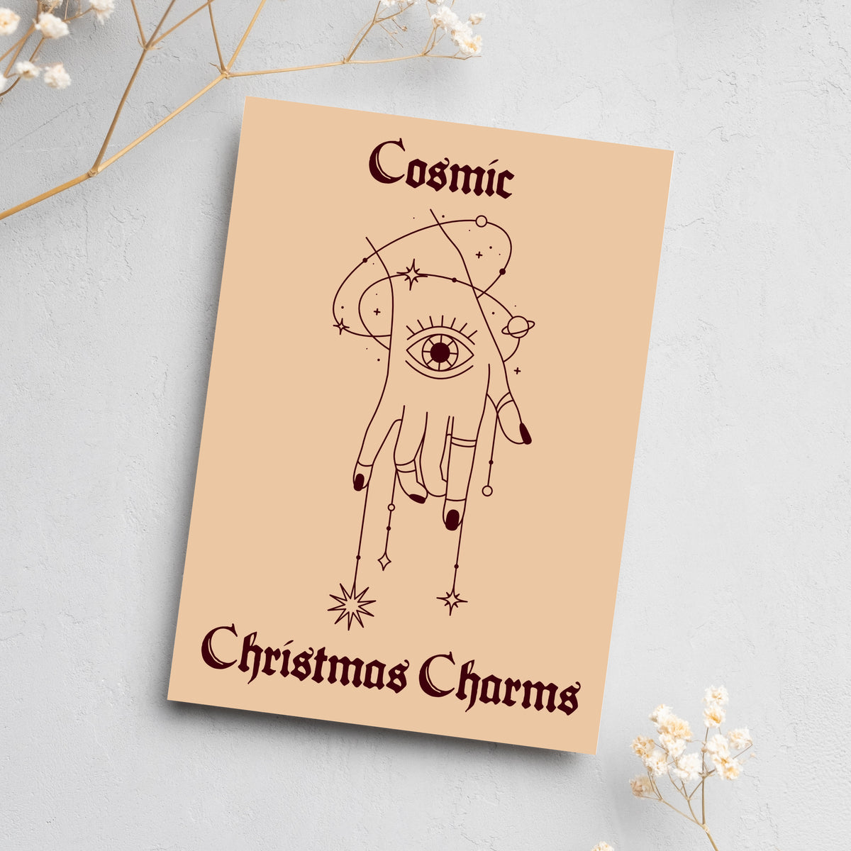 Four alternating holiday card designs with line-art sun, moon, stars, and snake motifs on muted cream and tan backgrounds.