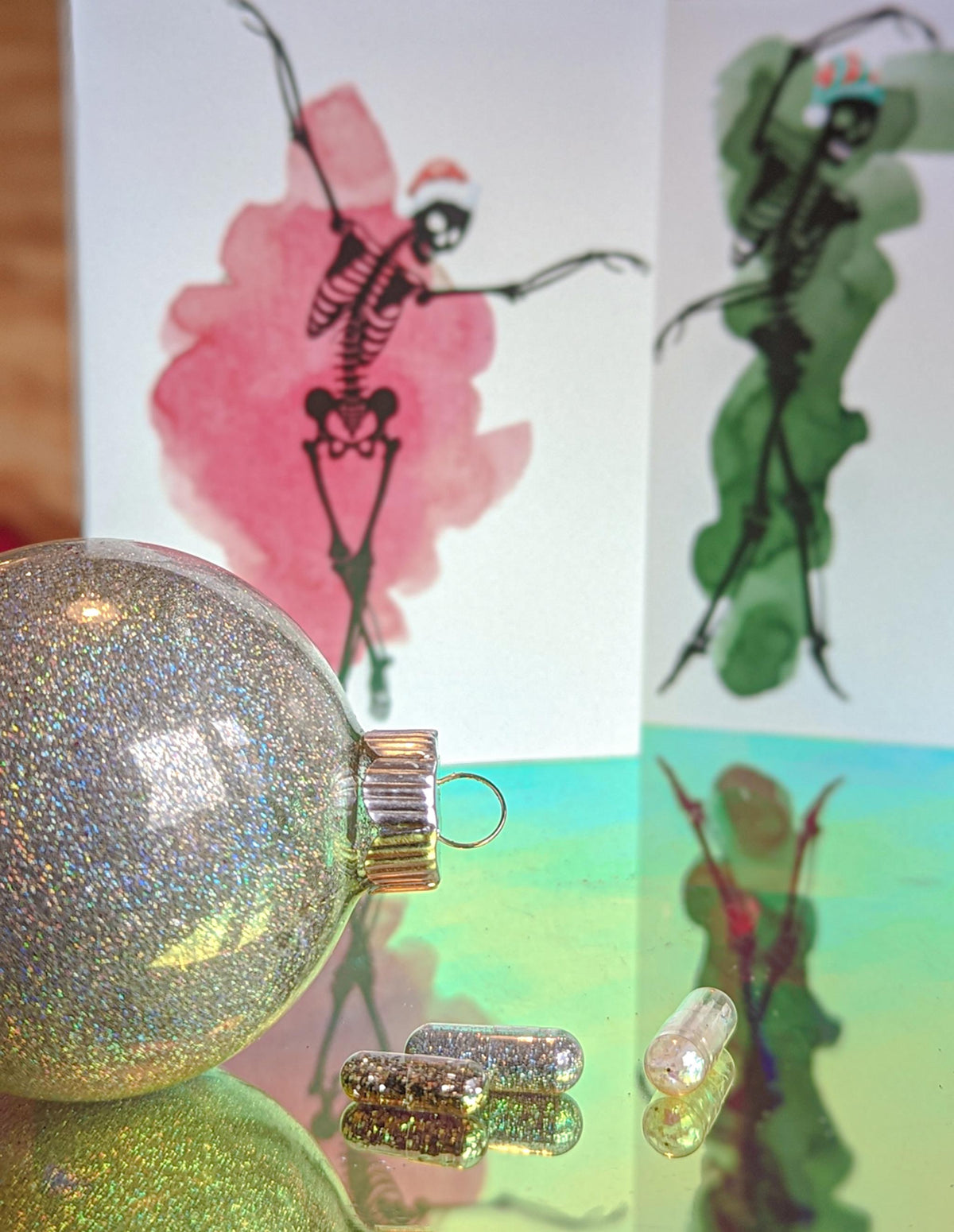 Greeting cards with skeleton ballet figures, watercolor splashes in six colors, no printed text on card fronts.