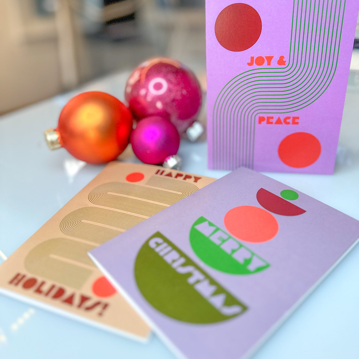Six geometric Christmas and New Year card designs, four cards each, in a boho color palette.