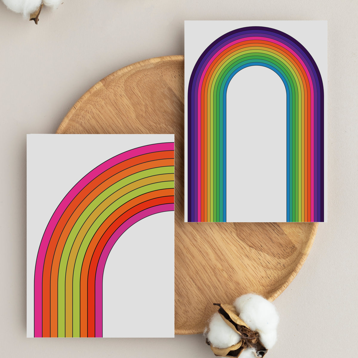 Cards in four designs: concentric rainbow arcs and horizontal stripe groupings, no text.