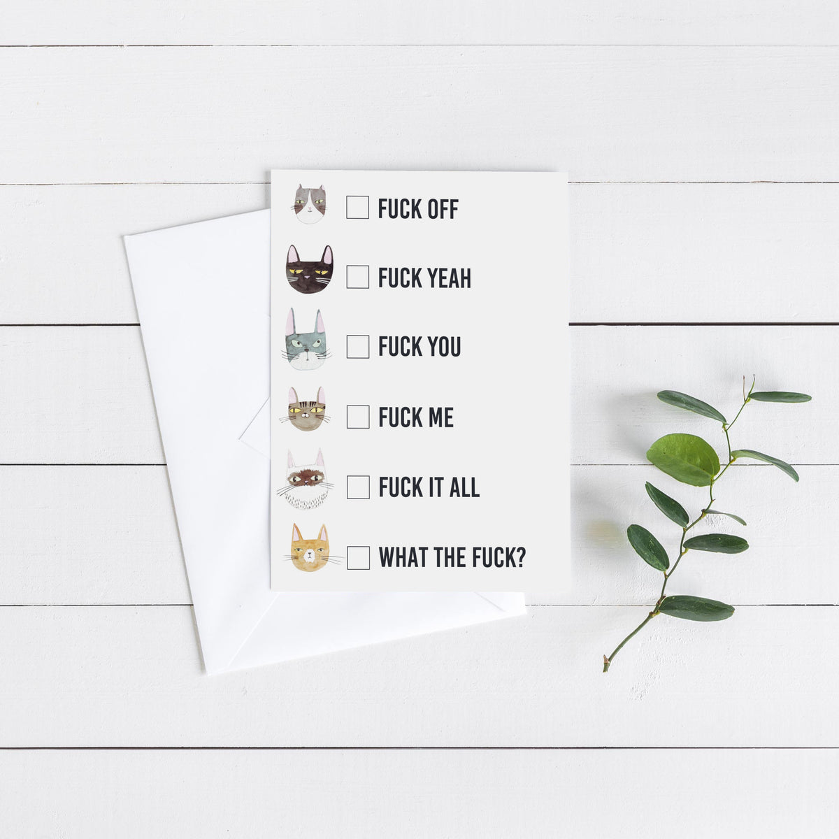 White card with six circular watercolor cat illustrations, empty checkbox squares, and bold sans-serif expletive text in each