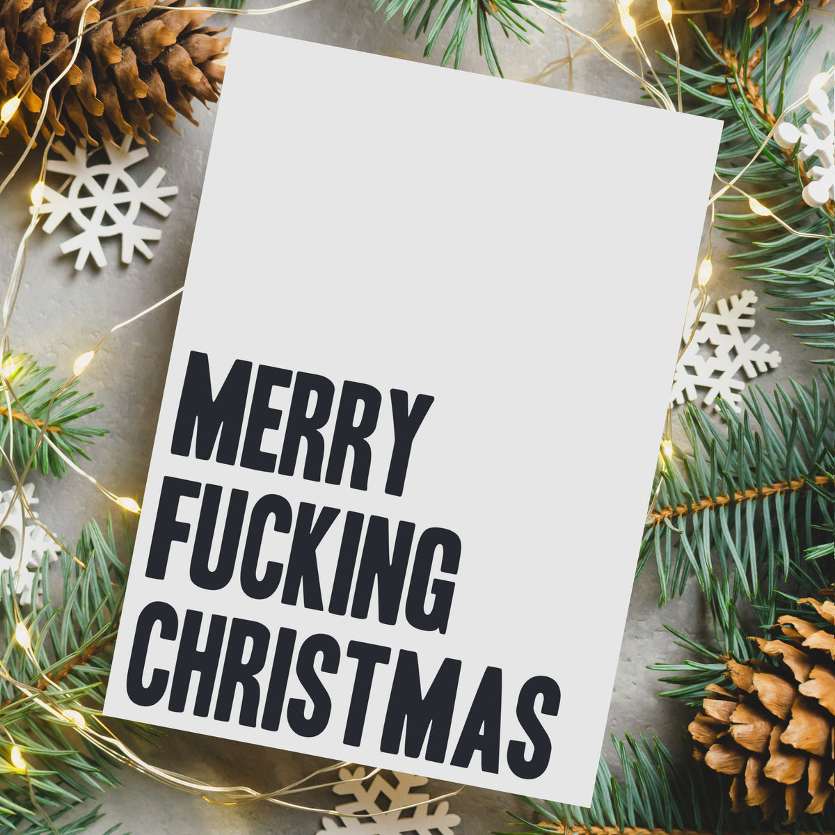 Twenty-four cards with "Merry Fucking Christmas" centered in block lettering or script on solid black or white backgrounds.