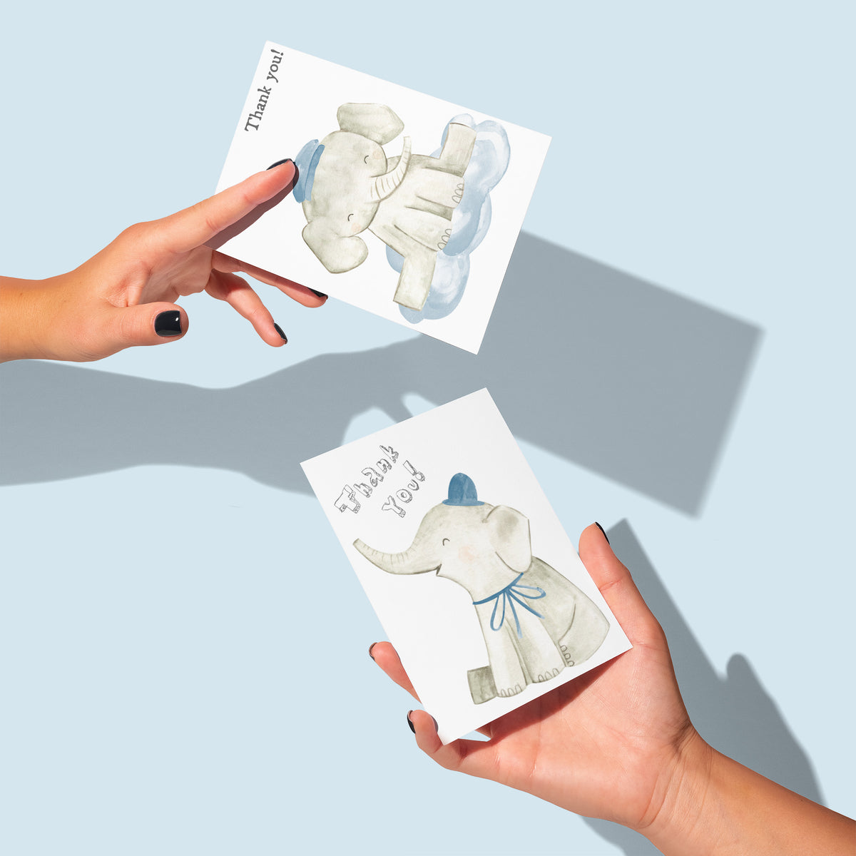 Set of 24 thank you cards with illustrated gray elephants and blue accents on a white card background.