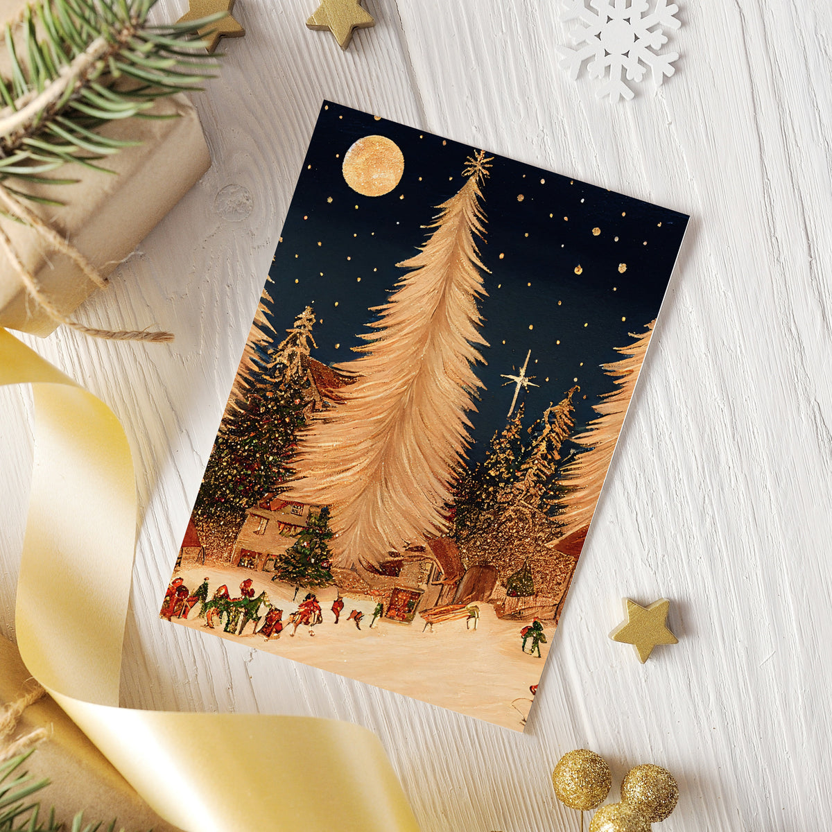 Christmas card set with illustrated night scenes of snow-covered villages and evergreen forests.