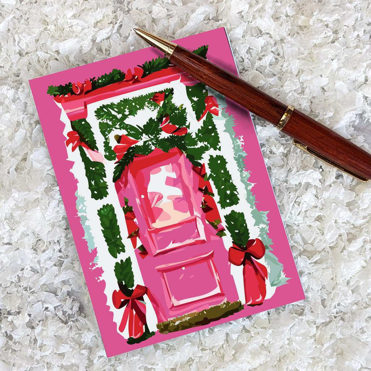 Christmas card pack of 24 featuring painted pink front doors adorned with holiday wreaths, garland, and red bows.