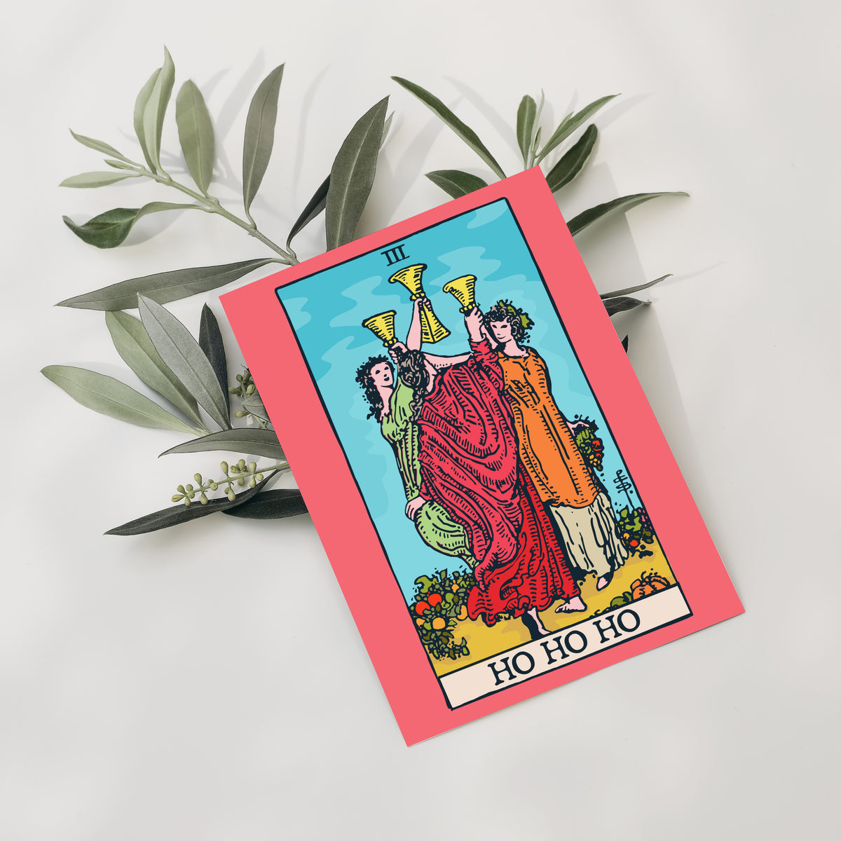 Card holiday set with tarot-style artwork, Roman numerals, and humorous Christmas phrases on cream banners.