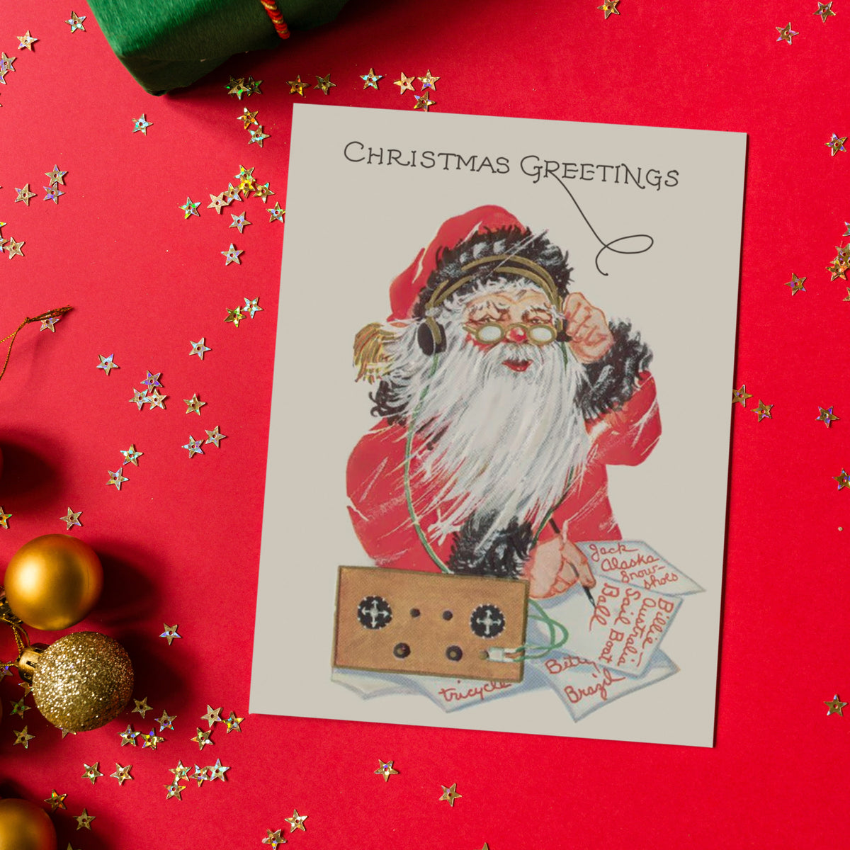 Vintage-style Santa illustration on Christmas cards, red coat, gold headphones, green cord, tan radio device.