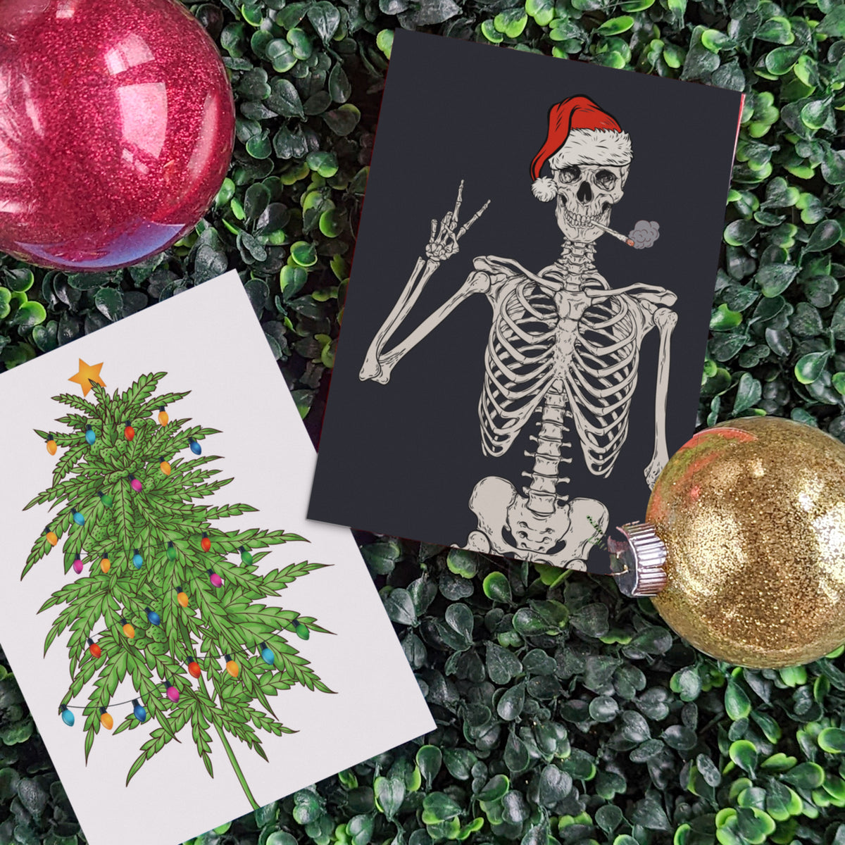 Folded greeting cards with cannabis-themed holiday art; envelopes included, blank inside.