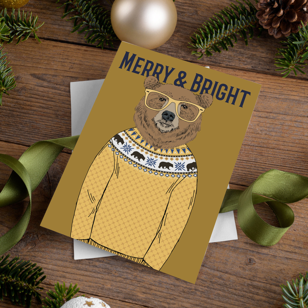 Folded holiday cards in six designs, each showing a glasses-wearing animal in a Fair Isle sweater, mustard-gold background.