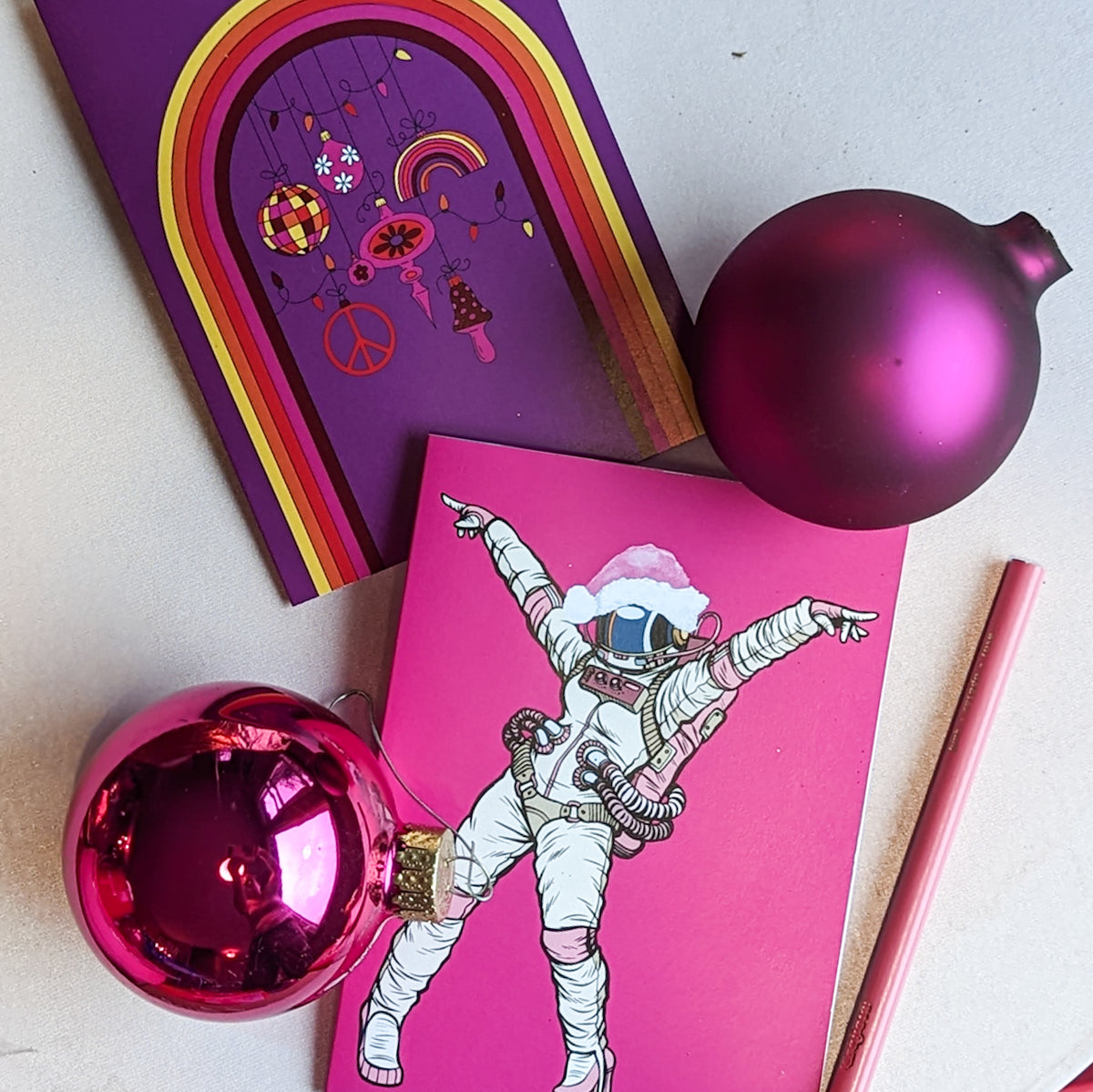 Folded holiday cards with phrases like "Fa La La La Llama," "Sleigh All Day," and "Holly Jolly."