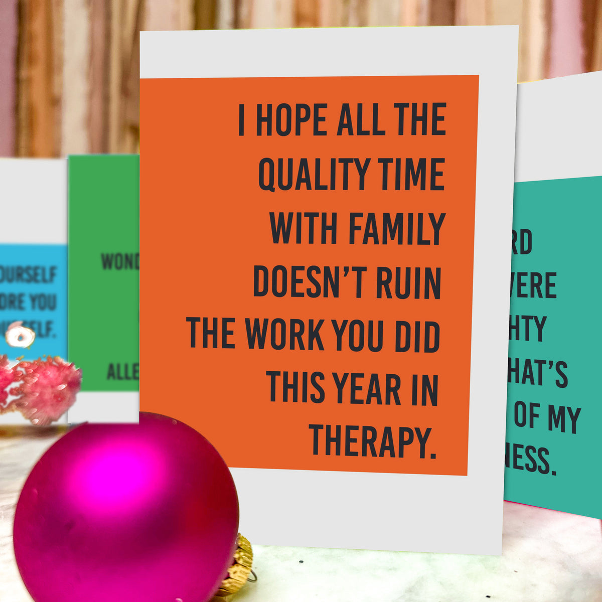 Six-design Christmas card assortment with condensed black all-caps text on yellow-green, orange, magenta, teal, green, and bl