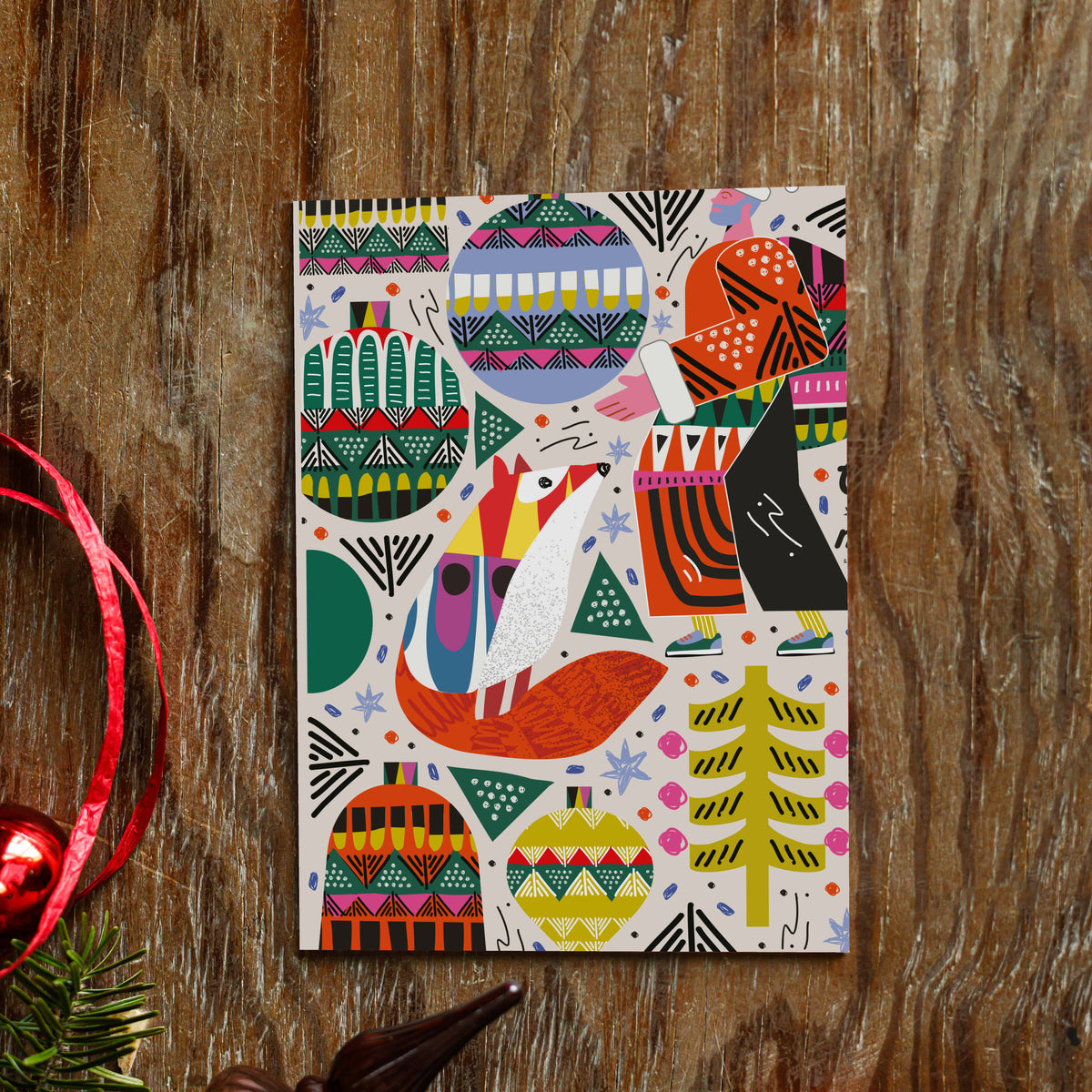 Four folk-art Christmas card designs: fox, ornament pattern, Merry Christmas script, and Santa figure.