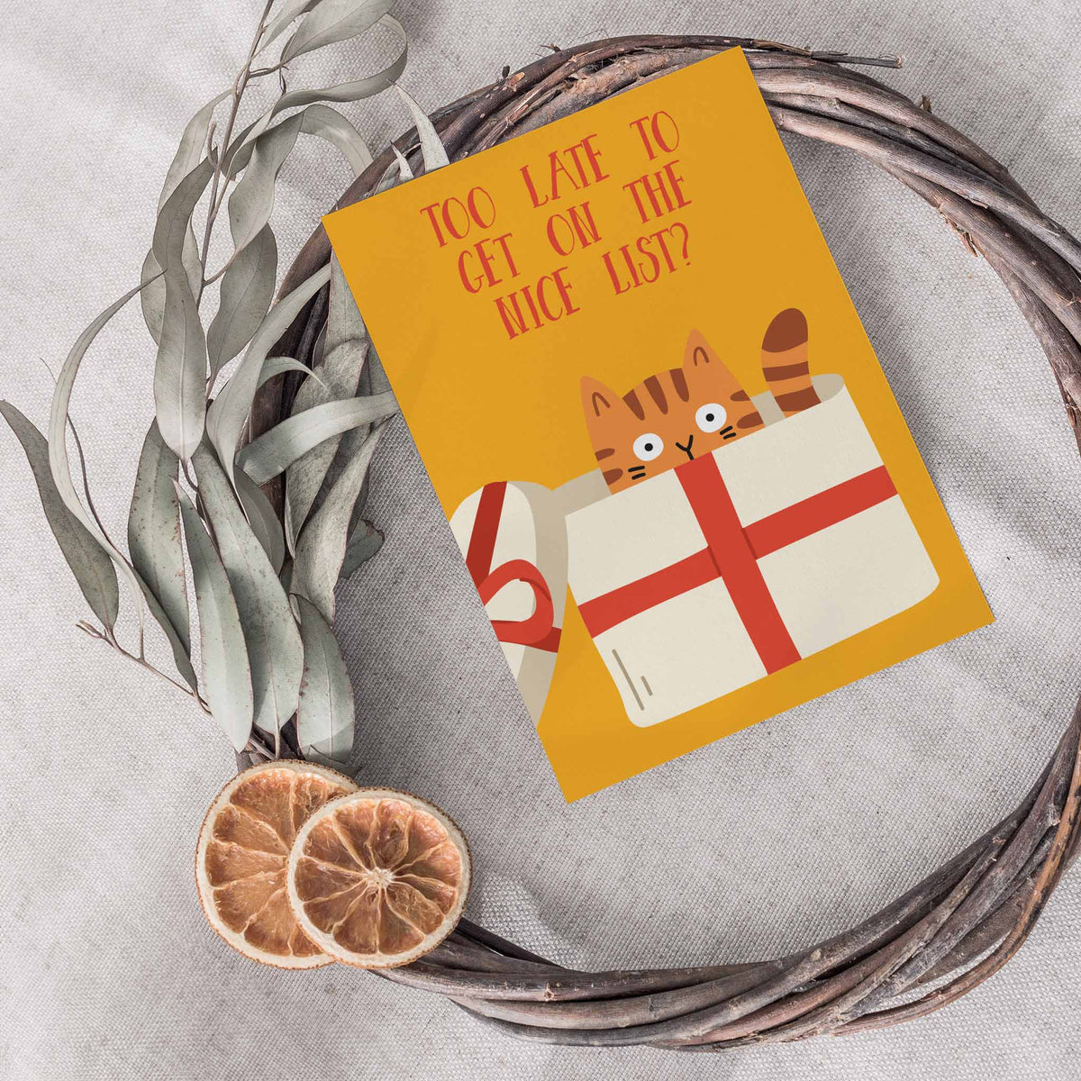 Greeting card set with cats in holiday scenes including Santa hats, ornaments, and string lights.