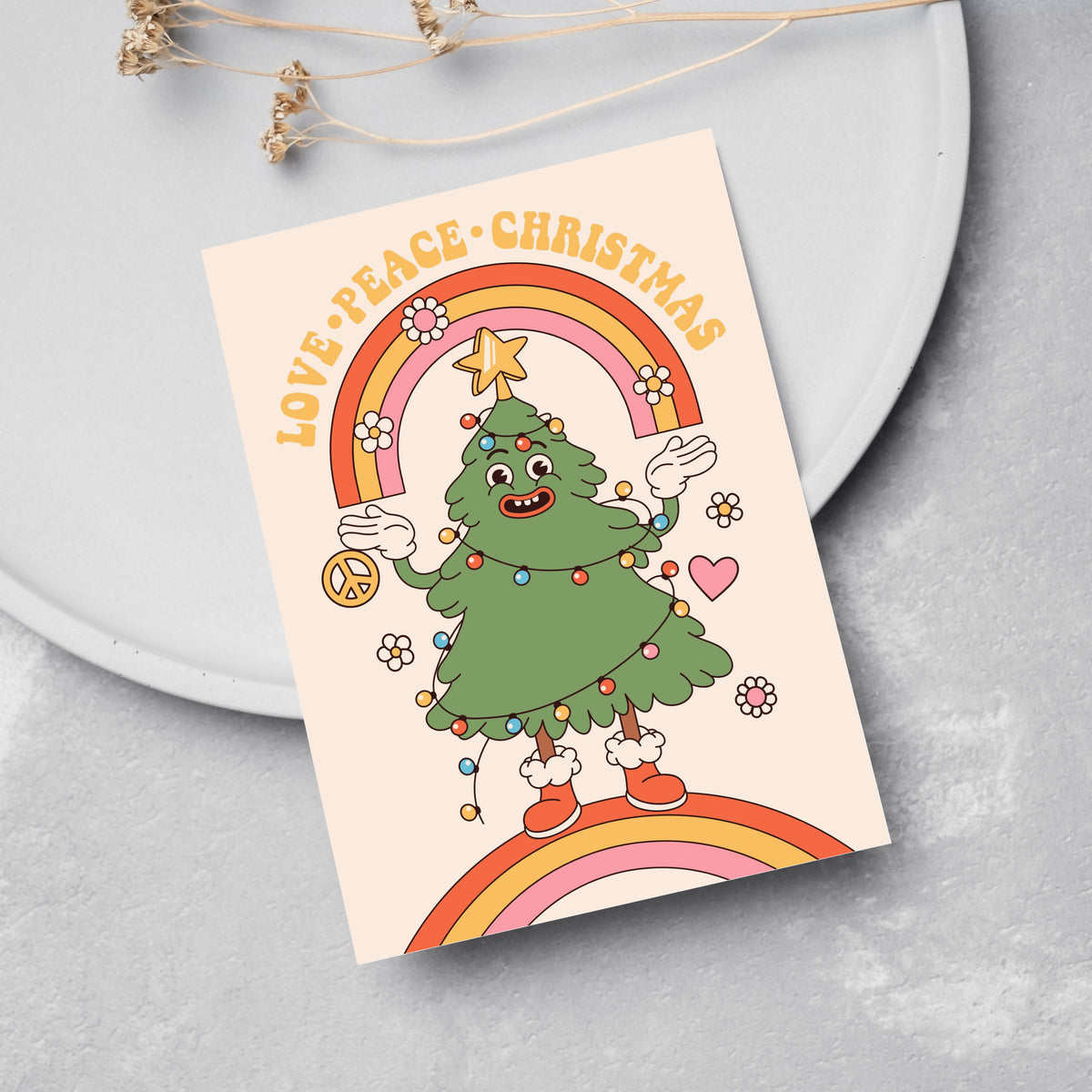 Christmas cards in 12 designs, each with a solid or patterned background and a centered character or motif.