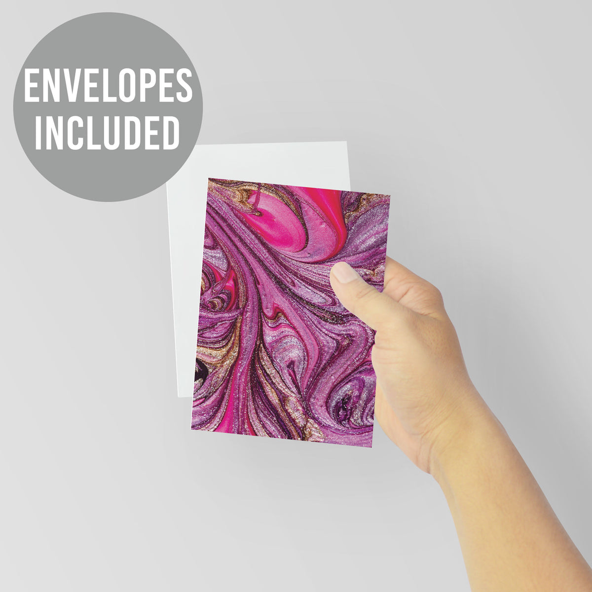 Blank cards printed with swirling pink, purple, and gold marbled designs.