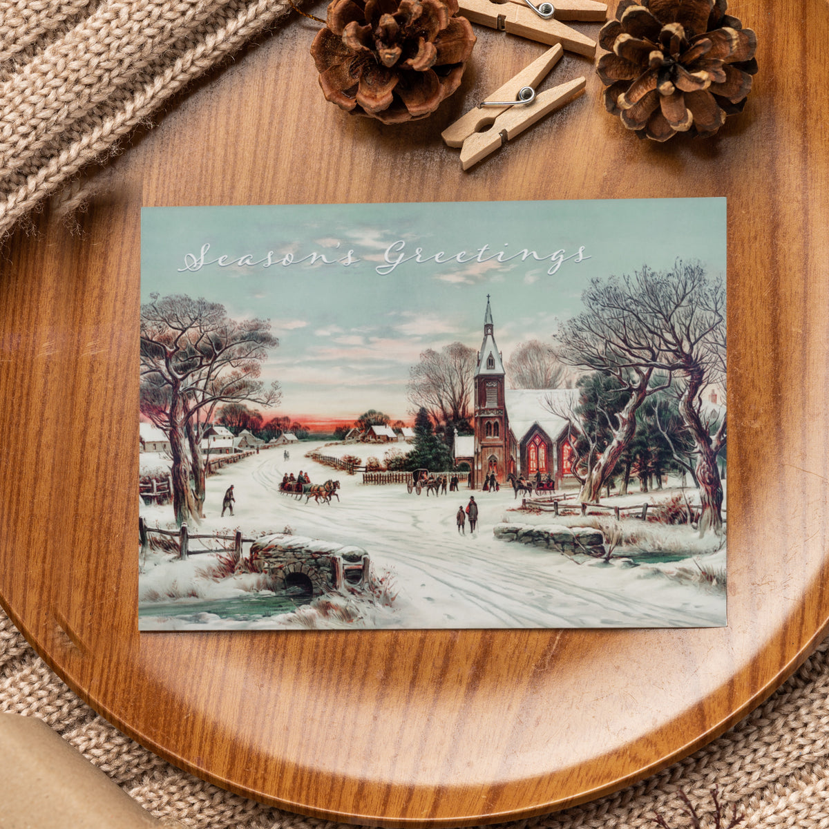 Set of 24 identical Christmas cards showing a snow-covered road, silhouetted figures, and a Gothic Revival church at sunset.