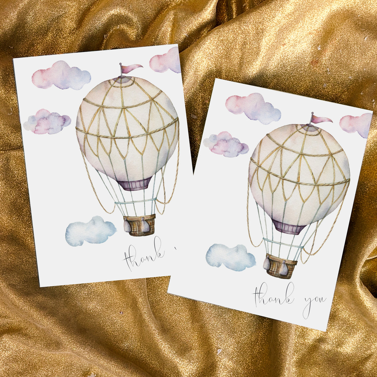 Set of 24 cards with lavender, pink, blue, and cream hot air balloon illustration on each front.