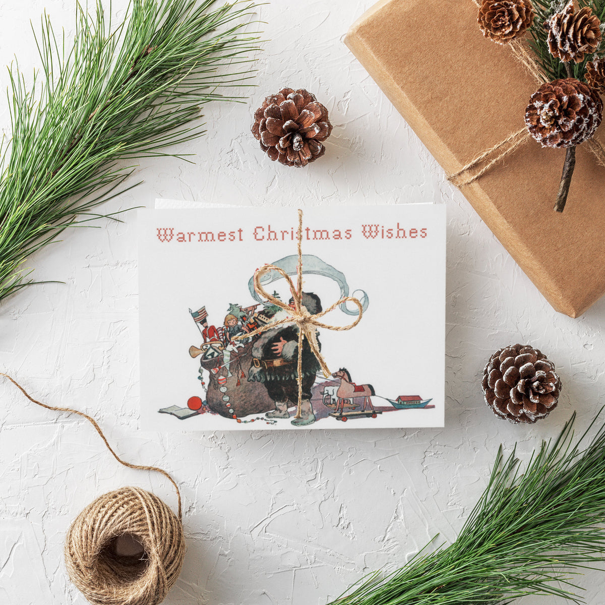 Santa holds a toy-filled sack; rocking horse, toy soldiers, and book at his feet; red typewriter-style text.