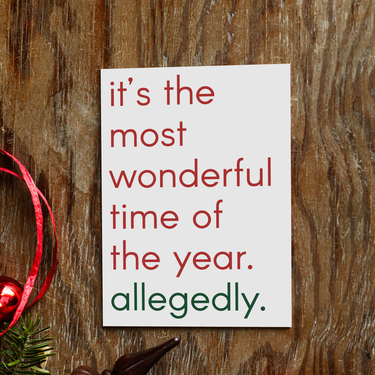 White card face with left-aligned lowercase lettering: "it's the most wonderful time of the year. allegedly."