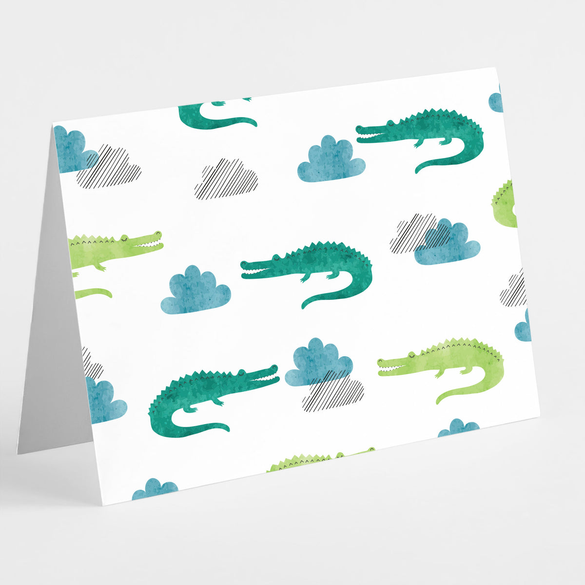 Card set with watercolor crocodilian allover prints in teal-green and lime, with cloud motif accents.