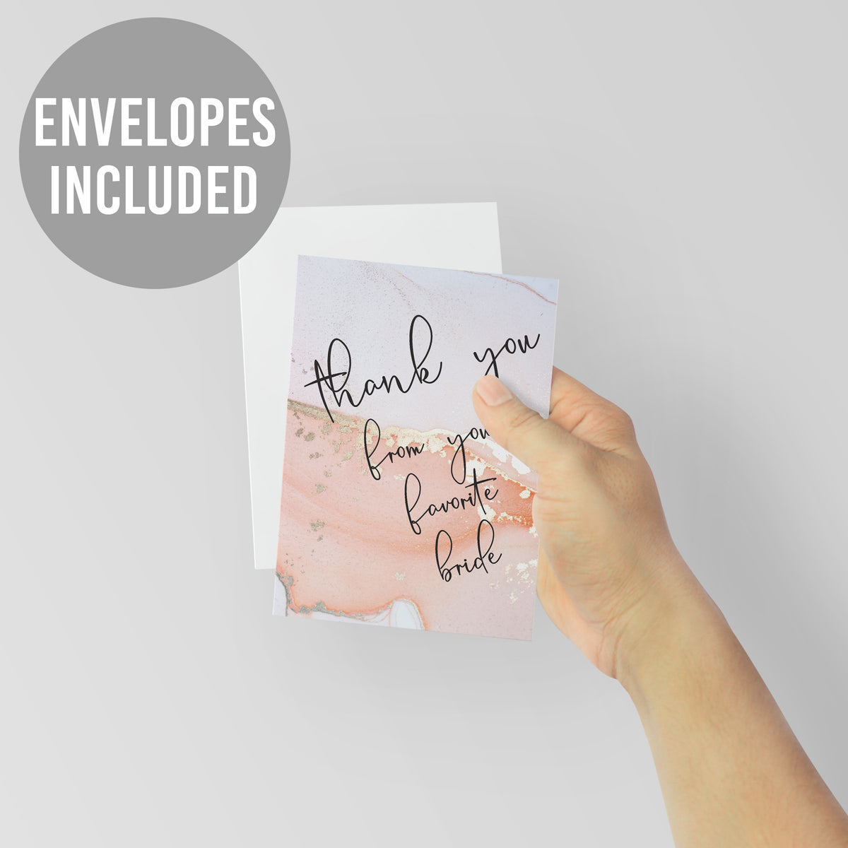 Blush, peach, and white marbled card with metallic gold accents and black script text, blank interior.