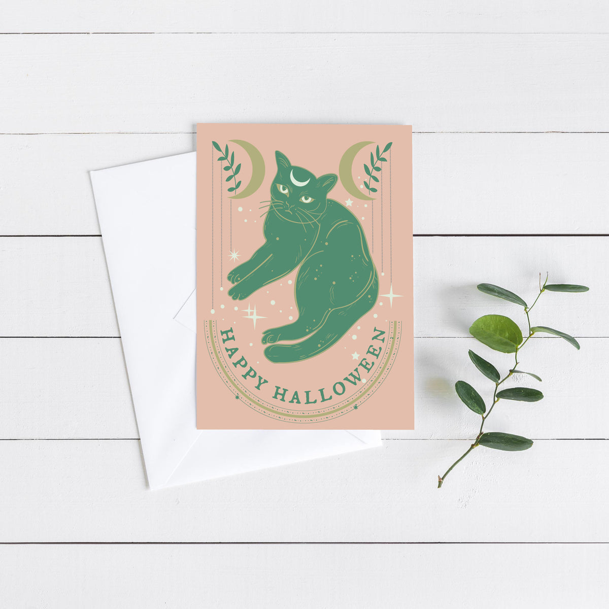 Halloween greeting cards printed with "Happy Halloween" in an arched all-caps serif font.