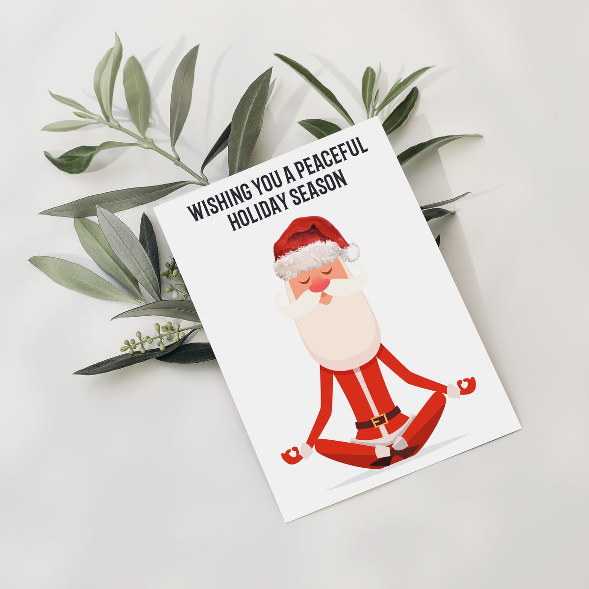 Santa Claus meditation illustration on white holiday cards, set of 24, bold black sans-serif text.
