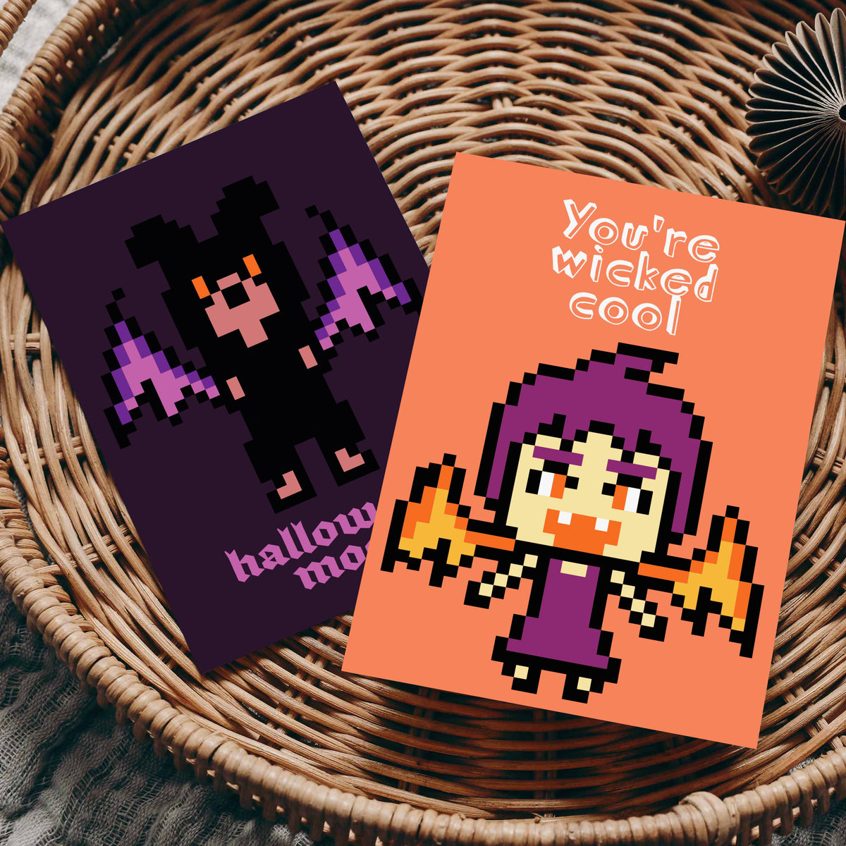 Pixel art Halloween cards with centered monster graphics and bold, saturated colors including teal, gray, and orange.