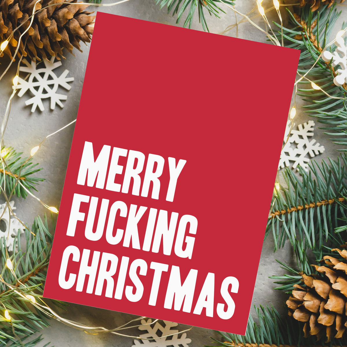 24-count Christmas card pack with bold sans-serif, blackletter, and cursive typography across 12 designs.