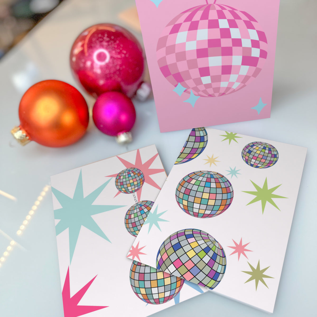Six-design Christmas card assortment with disco balls, mirror ball ornaments, and star-topped holiday trees.
