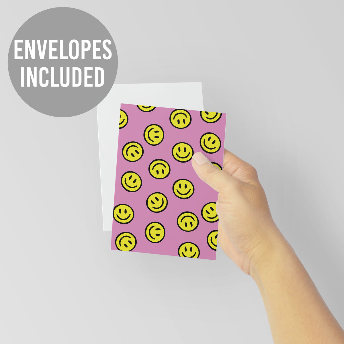 Pink greeting cards with a full-bleed repeating smiley face icon pattern.