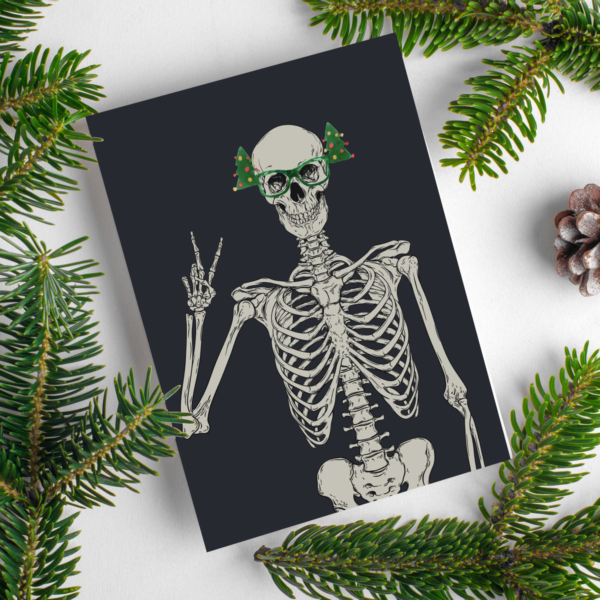 Set of 24 skeleton holiday cards, one design featuring a skeleton in Christmas-tree-shaped green glasses.
