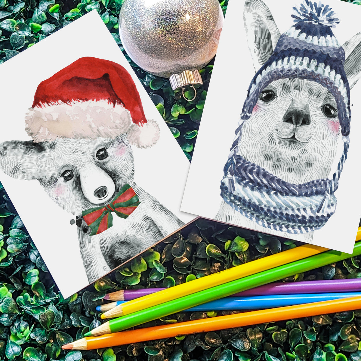 Holiday card set with illustrated llama, bear cub, sloth, and spotted cub wearing knit hats and scarves.