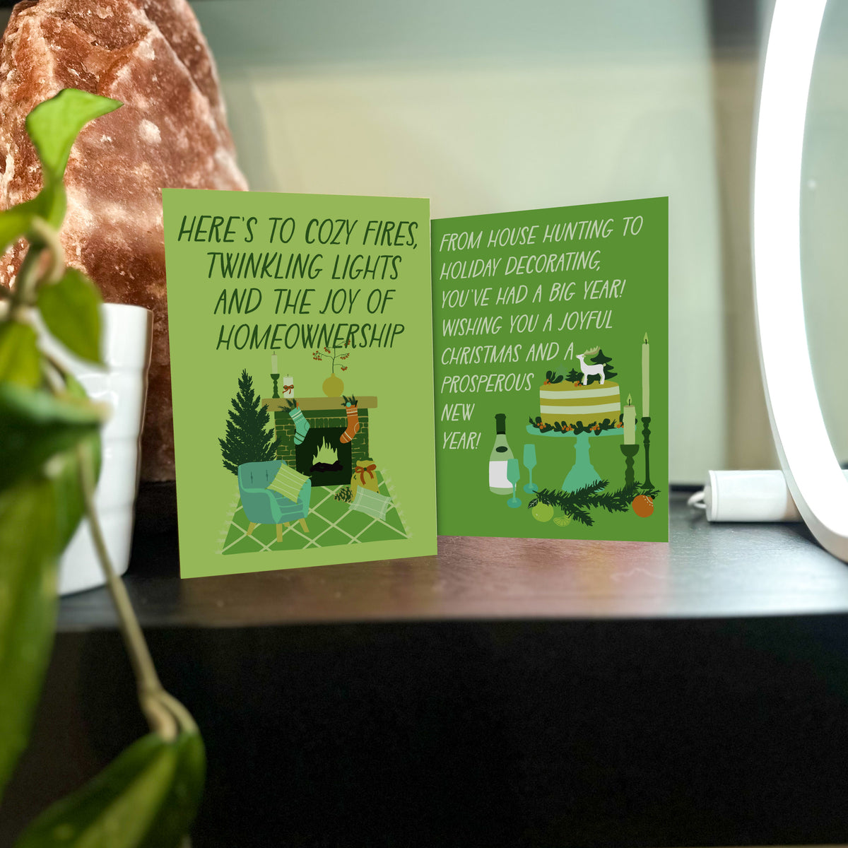 New home Christmas card set, 24 cards in 6 designs, illustrated in shades of green, teal, orange, and cream.