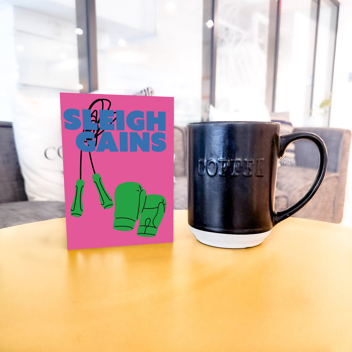 Set of 24 cards in six designs, each with a two-line fitness Christmas pun and a flat-color workout equipment graphic.