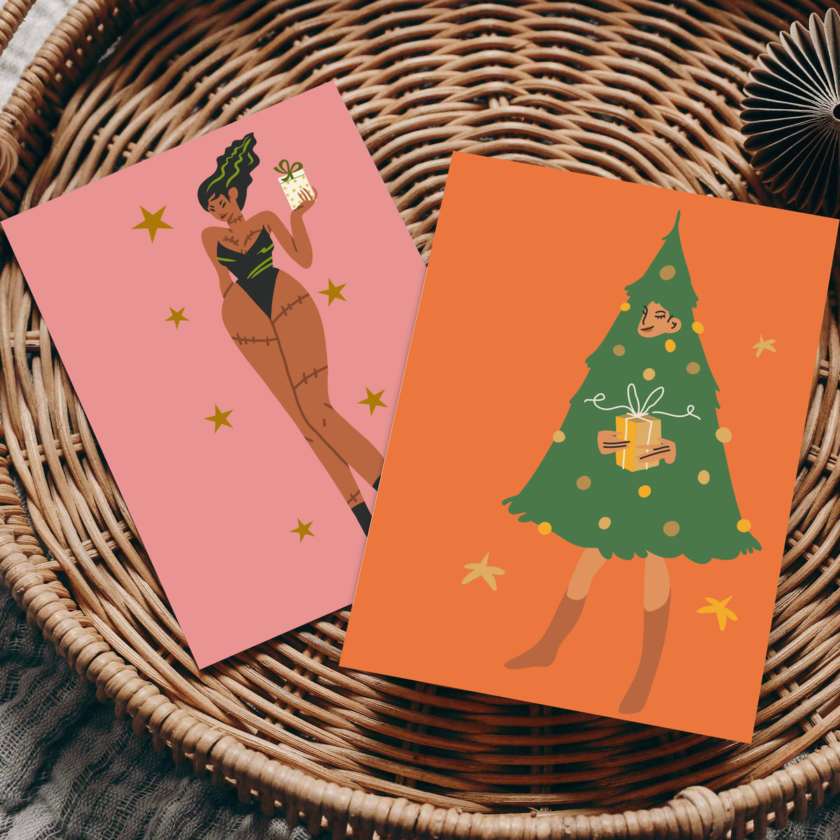 Pin-up style holiday cards, 24 count, with gold star accents and grounds in orange, red, coral, magenta, and pink.