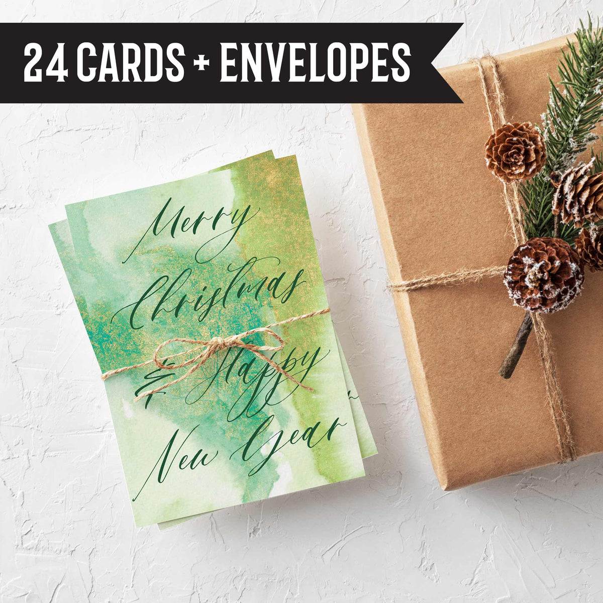 Christmas note card set with watercolor wash backgrounds, gold geometric frames, and script and block lettering.