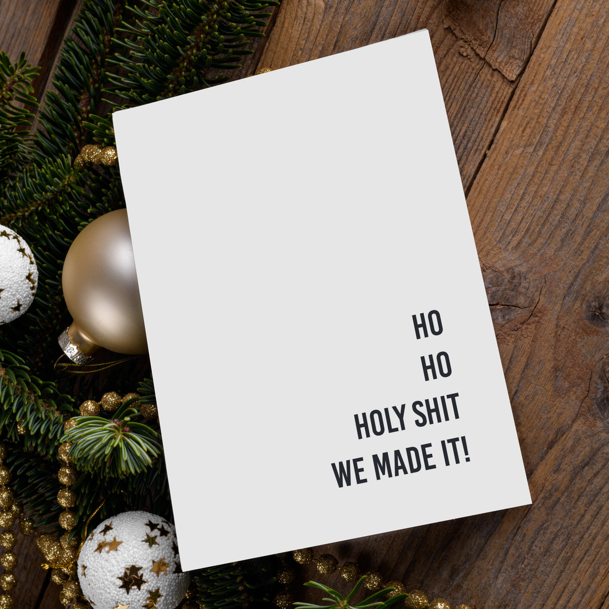 White folded cards with right-aligned bold black sans-serif text, 12 snarky Christmas phrases.