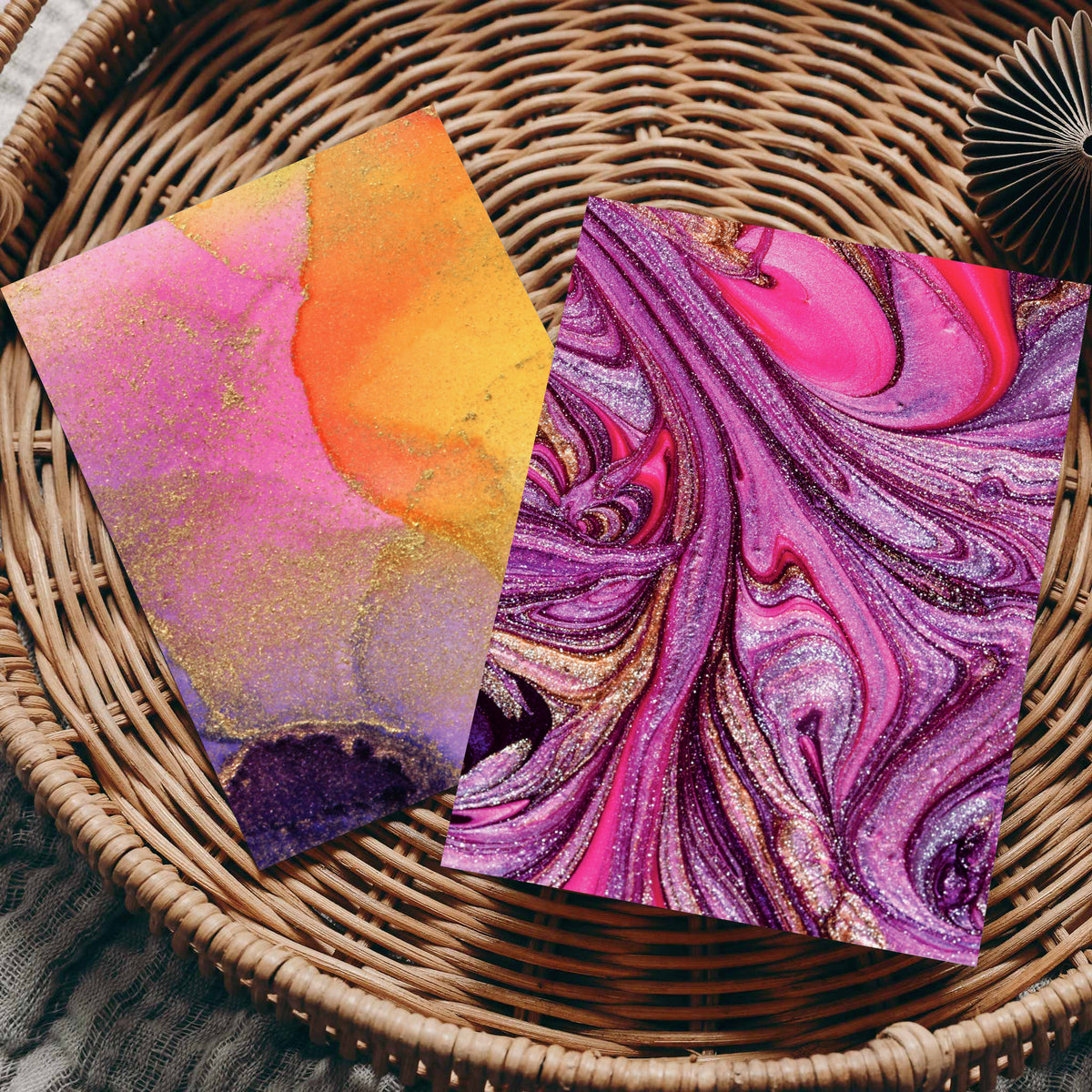 Four abstract brushstroke and swirl designs repeated across a 24-card stationery set.