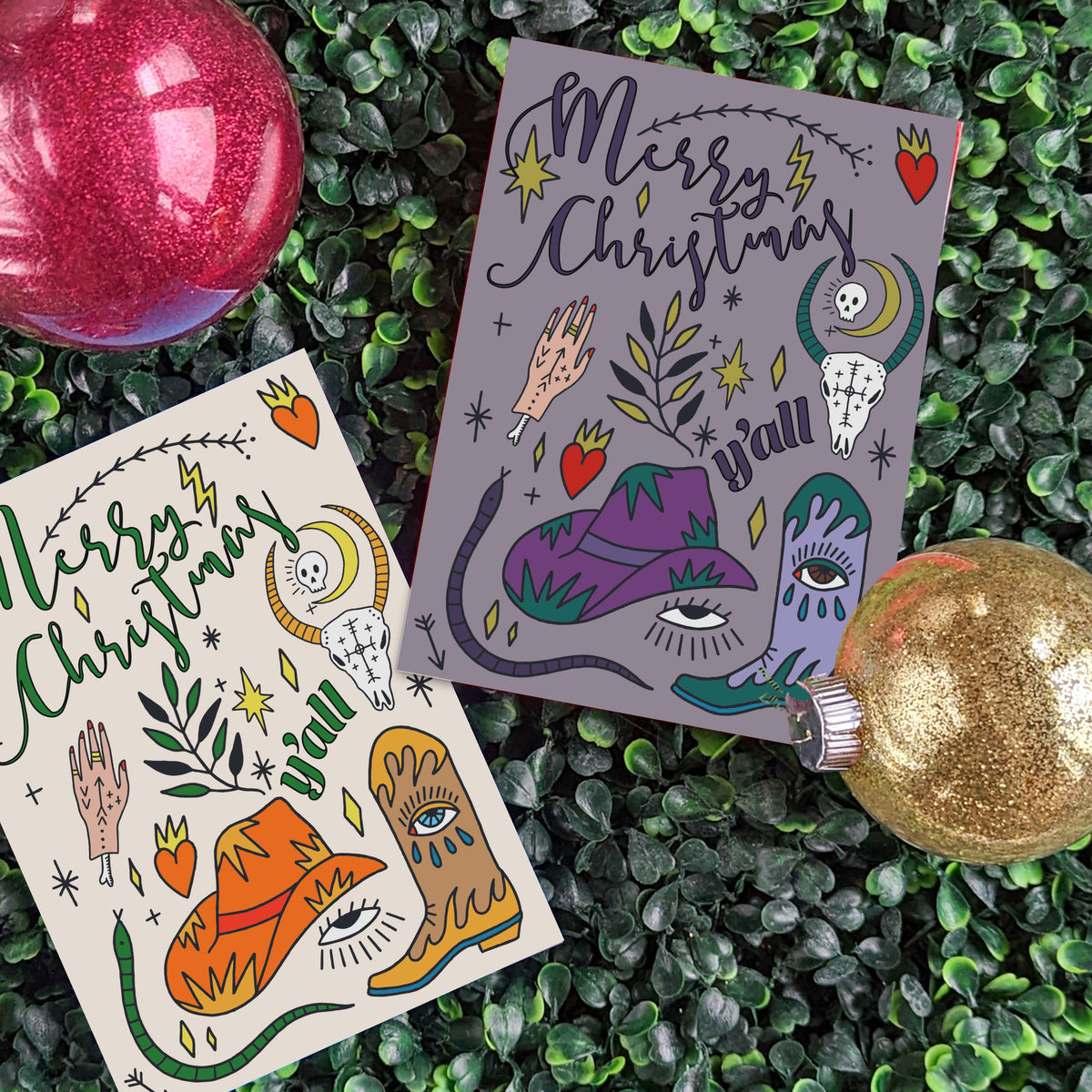 Christmas cards with brush-script "Merry Christmas" and block-lettered "y'all" on four different colored backgrounds.