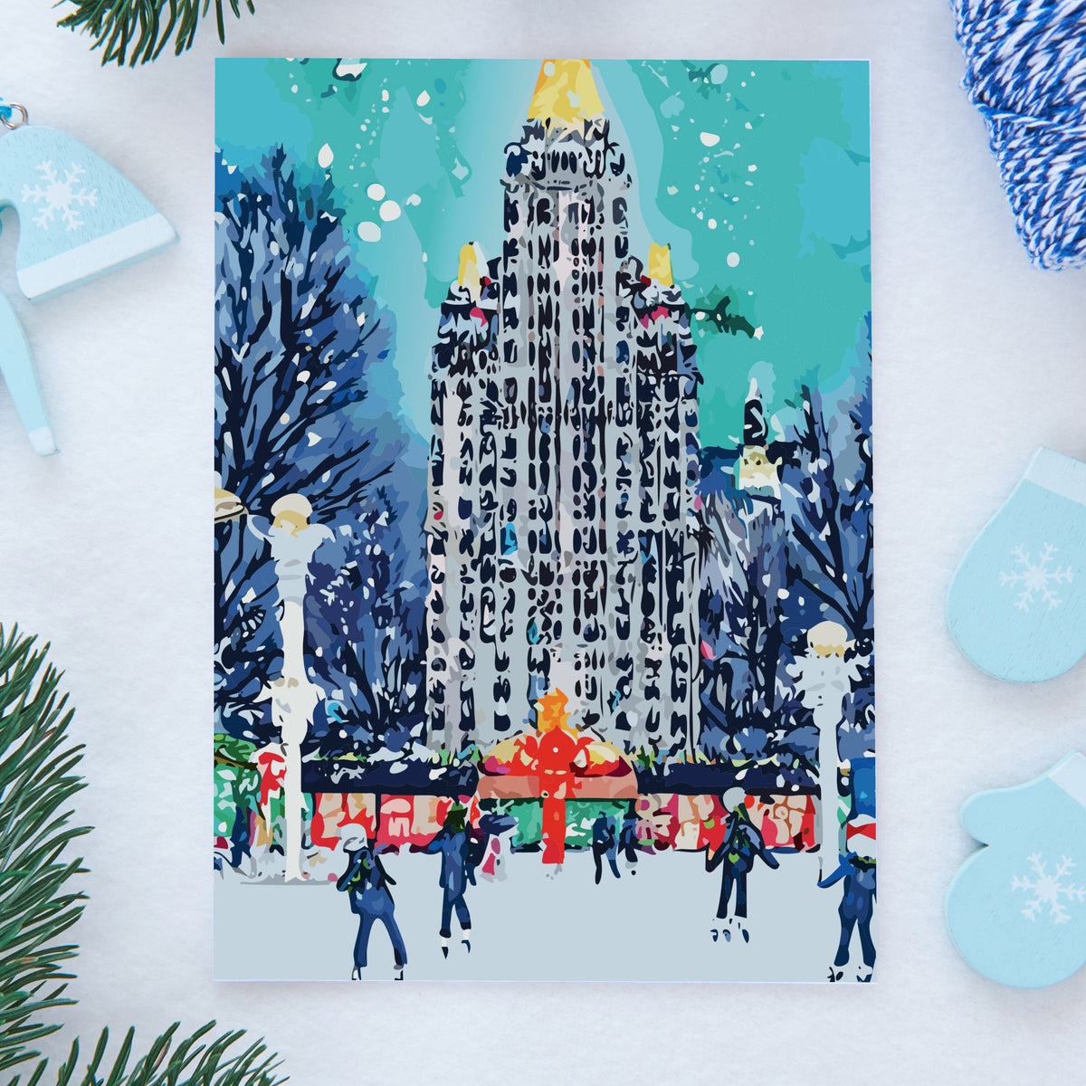 Notecards in six designs depicting snow-dusted skylines, decorated trees, and ice rinks with small skater figures.
