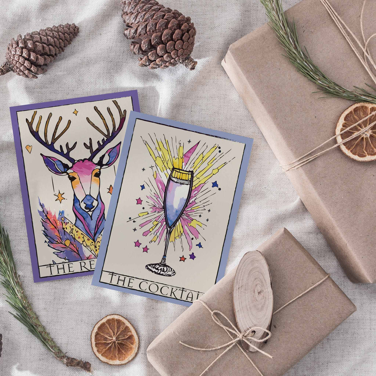 Watercolor-style holiday illustrations on 24 tarot-layout cards with bold ink outlines and jewel-tone palettes.