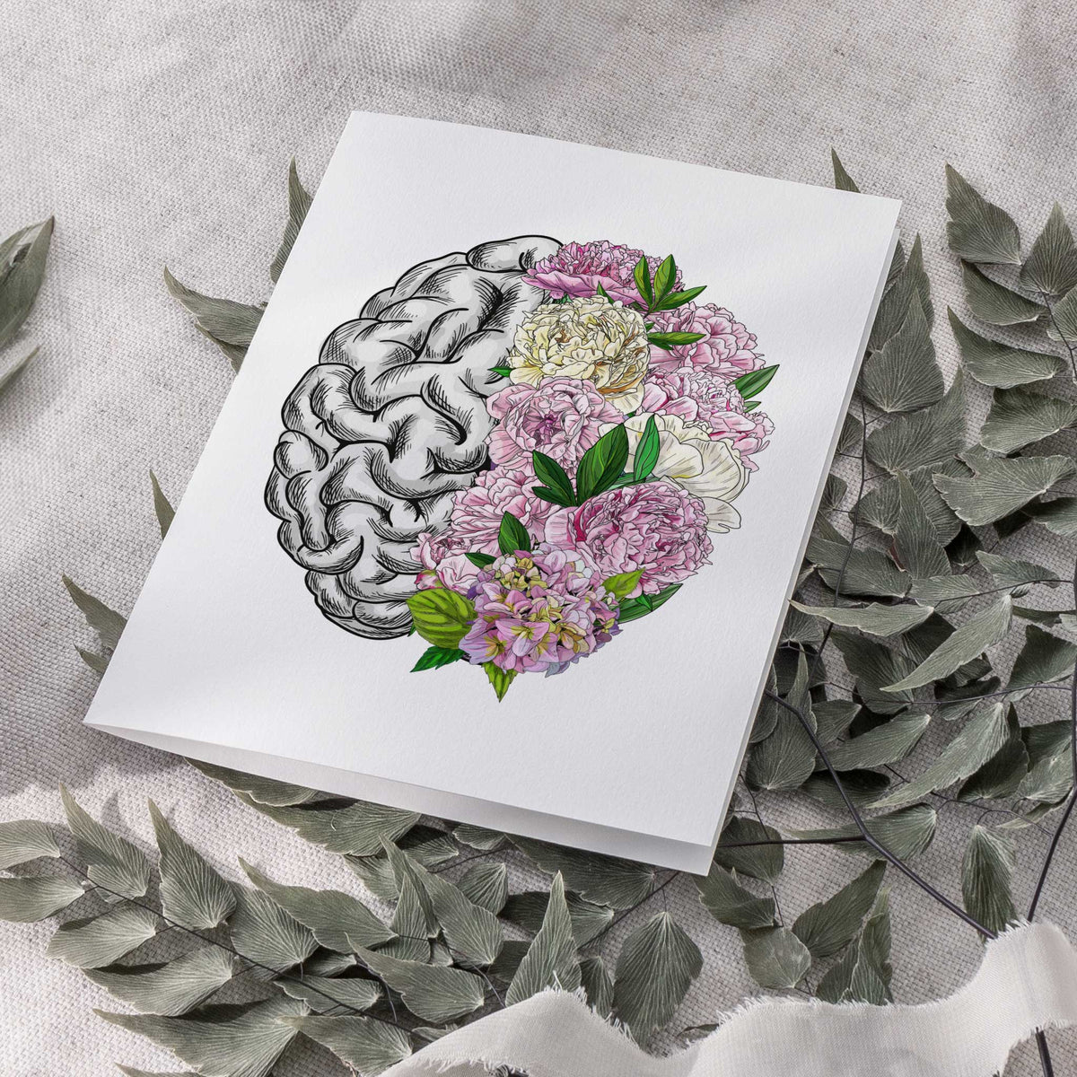 Brain illustration card with cross-hatched left hemisphere and floral right hemisphere filled with layered blush and magenta.