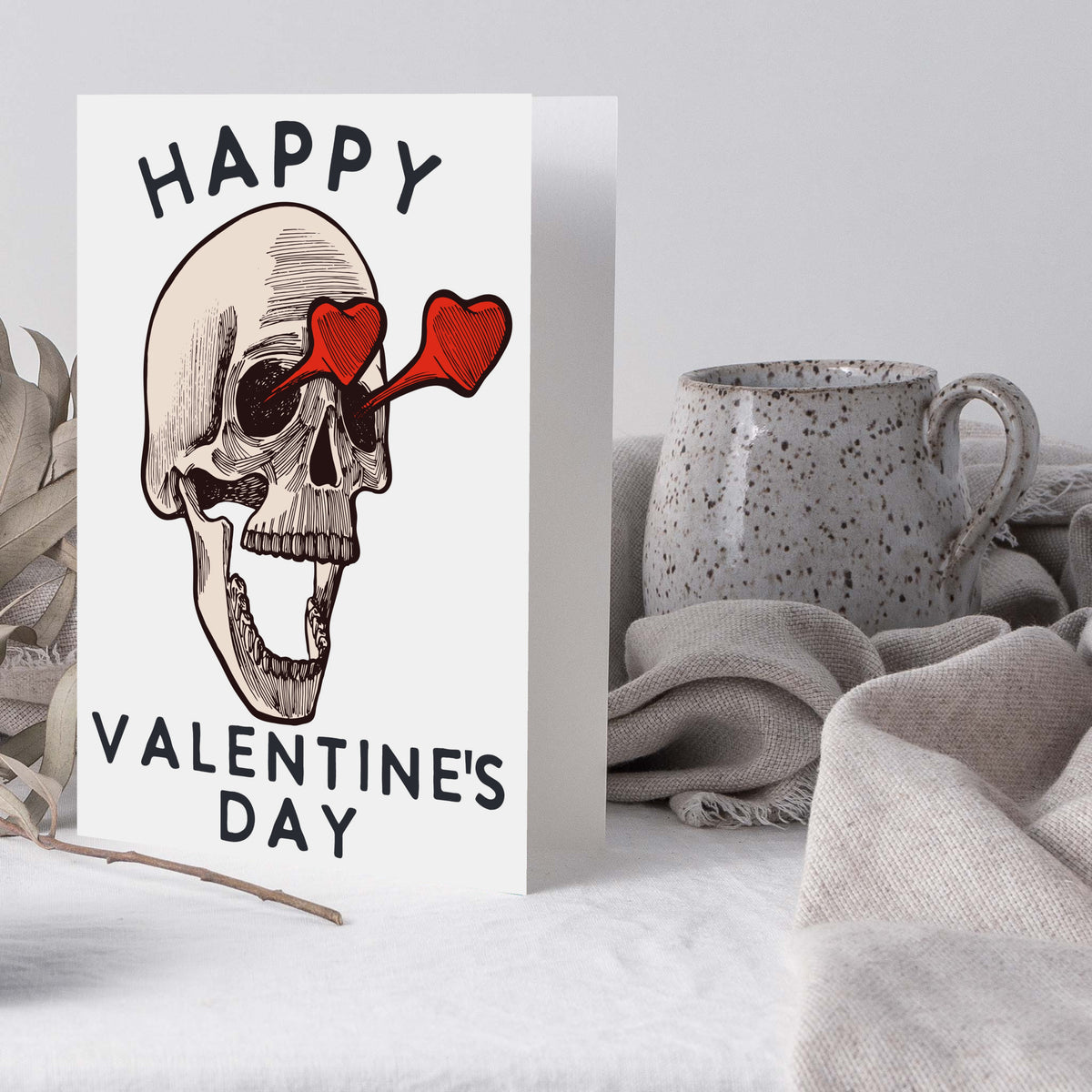 Single-design 24-card set with skull illustration, solid red heart glasses over eye sockets, arched and stacked sans-serif te