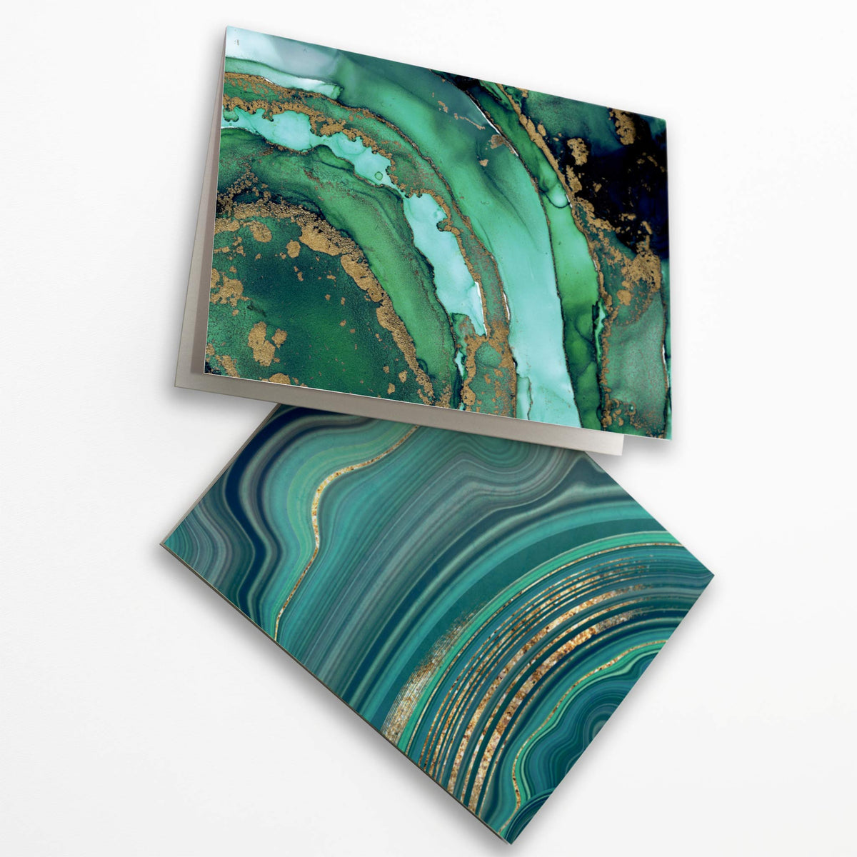 Correspondence cards with geode-inspired abstract patterns in green, turquoise, teal, and black.