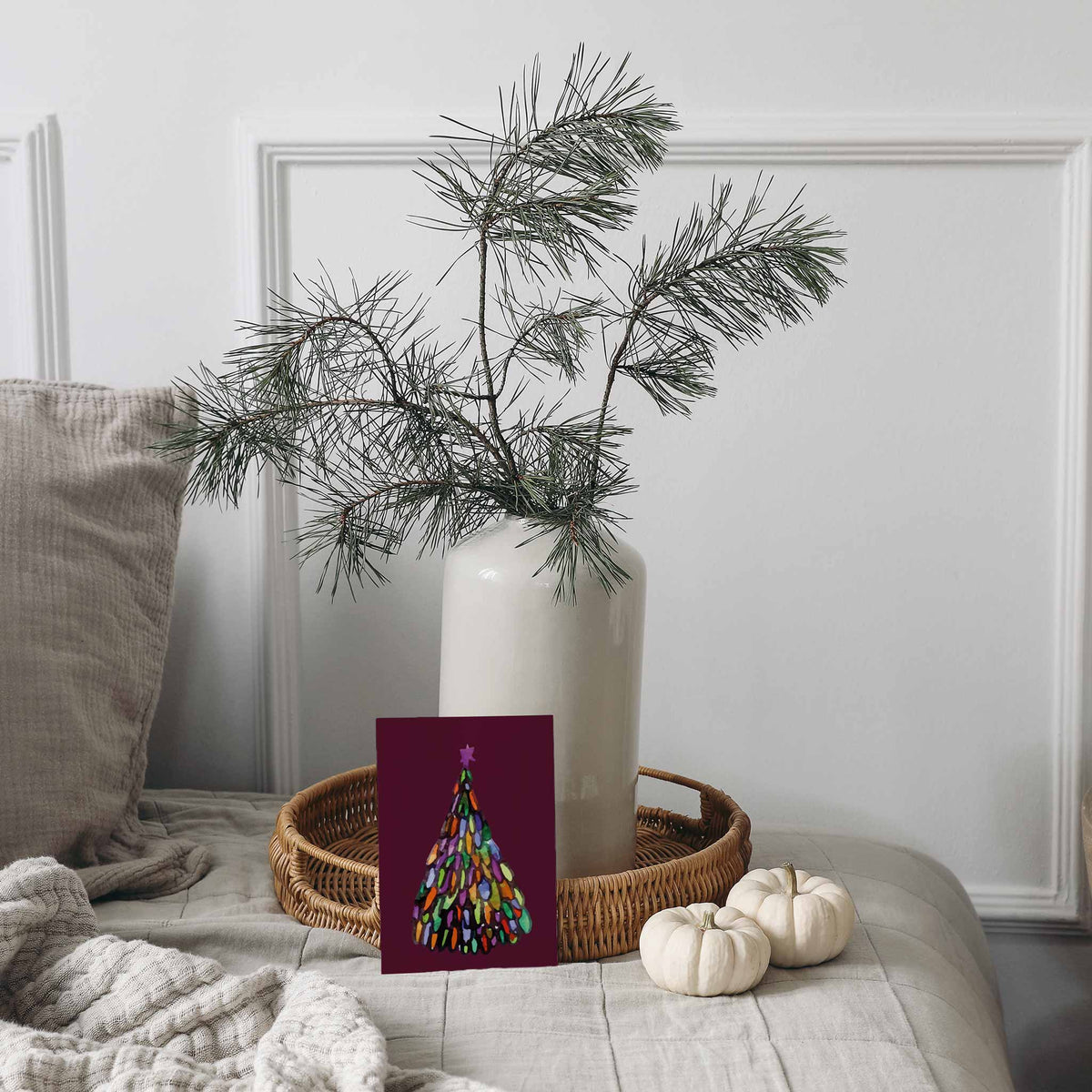 Twelve abstract Christmas tree designs printed on cards with solid color backgrounds, 24 total.