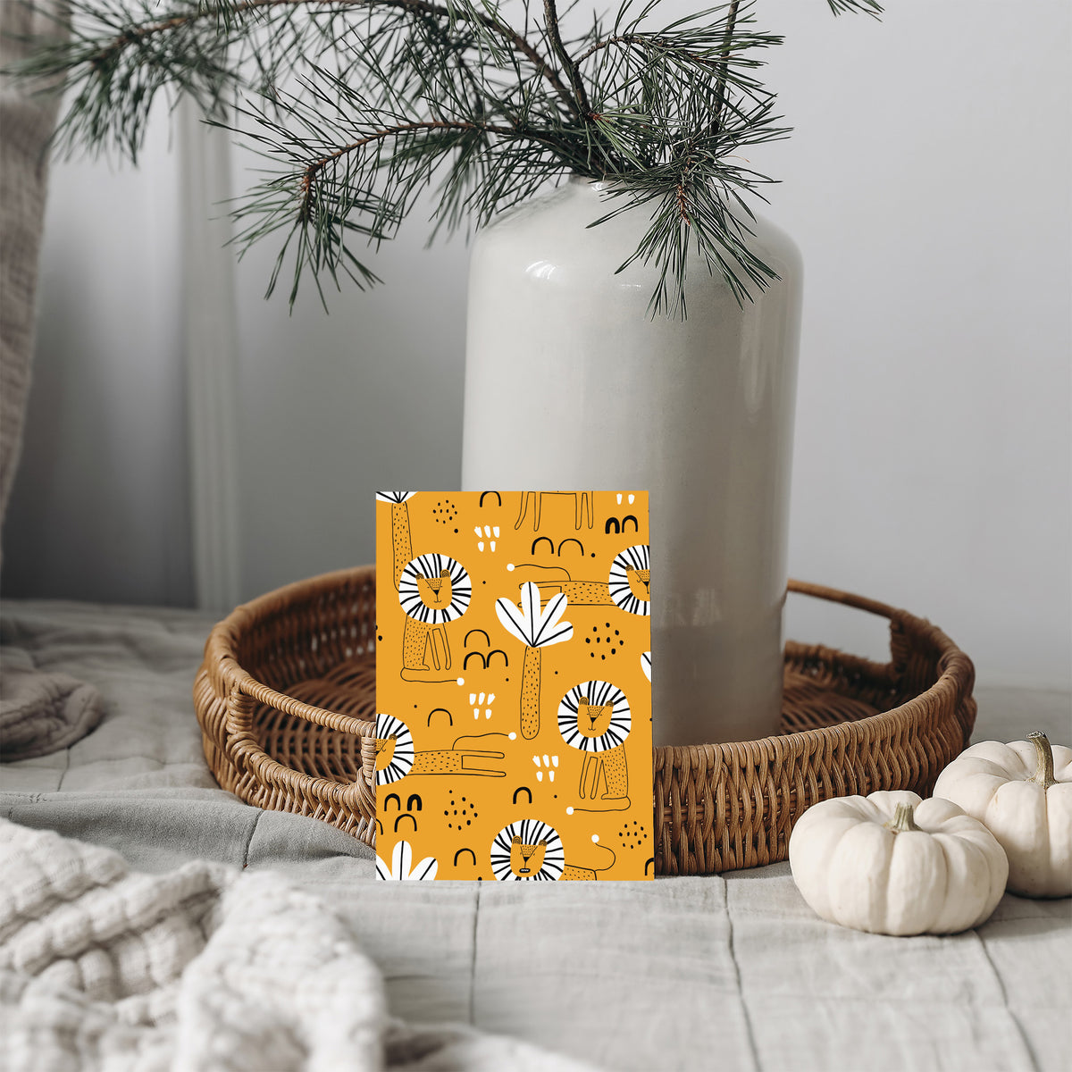 Card boxed set with an allover lion illustration pattern in mustard yellow, black, and white.