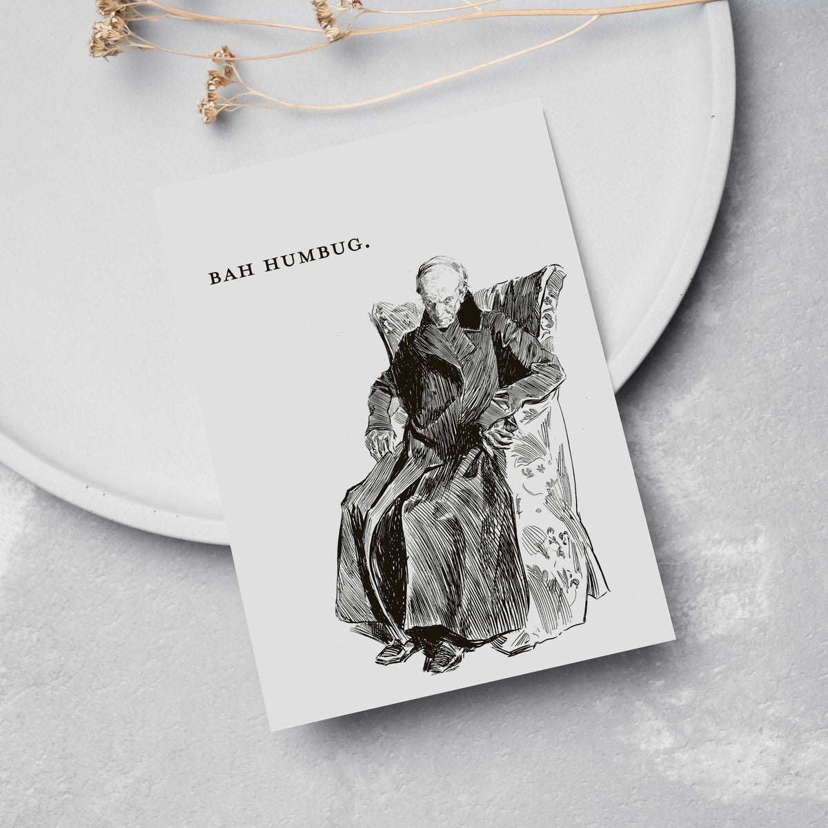 Card holiday set, one design, black line art of a scowling seated figure with "BAH HUMBUG." lettered at upper left.