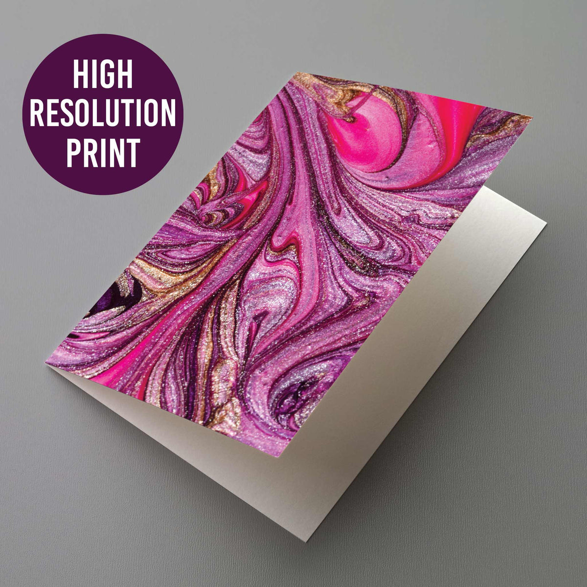 24-piece notecard set with colorful abstract marbling in pink, purple, and gold.